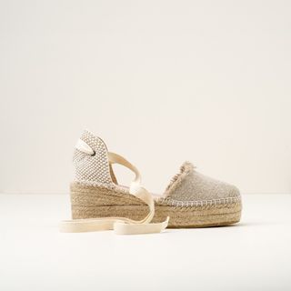 beige espadrilles with white ties