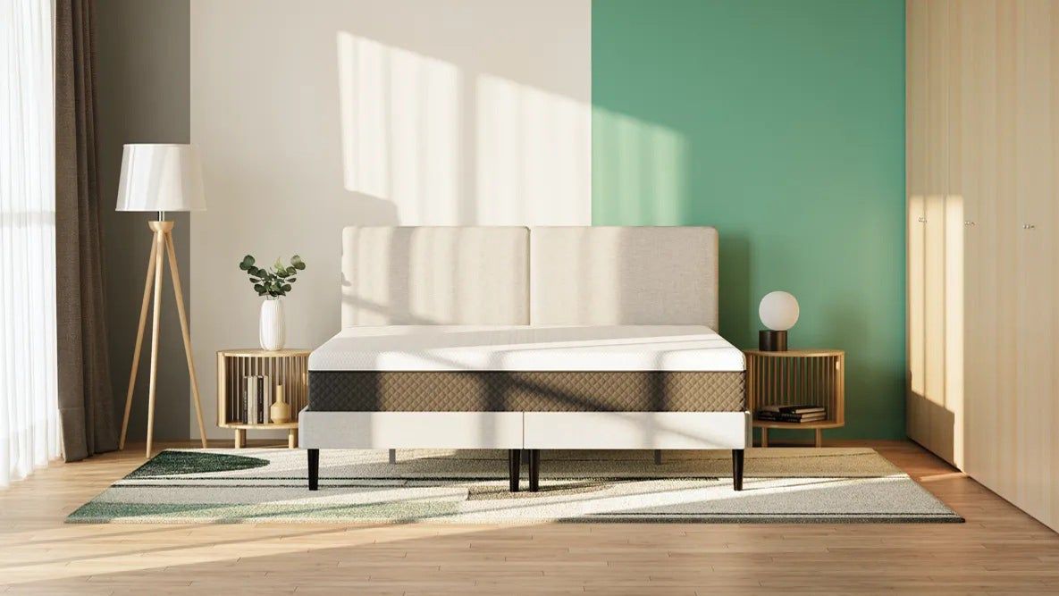 The Emma NextGen Premium mattress in a room with a half green and half white wall