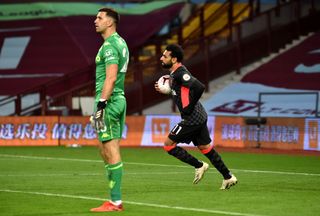 Mohamed Salah, right, retrieves the ball after scoring against Aston Villa