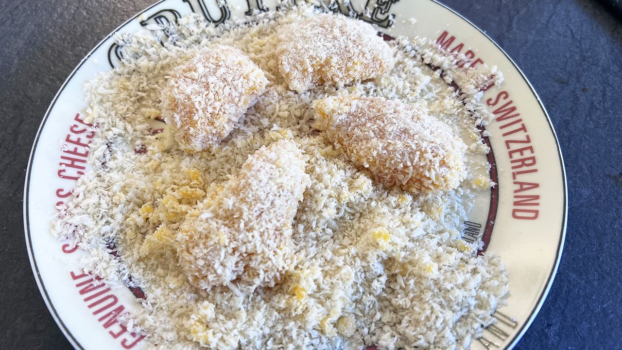 Coating being added to chicken pieces