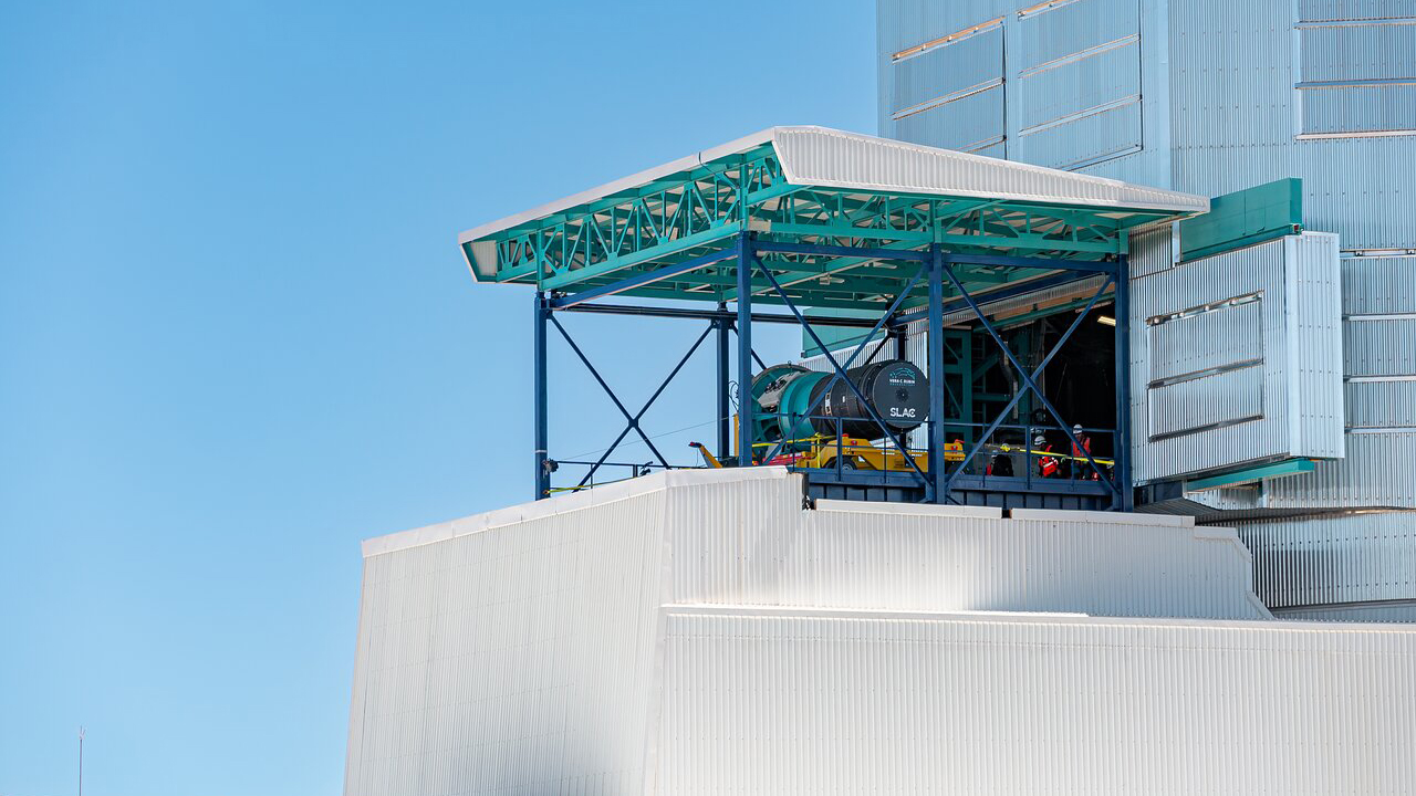 The Legacy Survey of Space and Time camera being installed by by a crew at the Vera C. Rubin Observatory