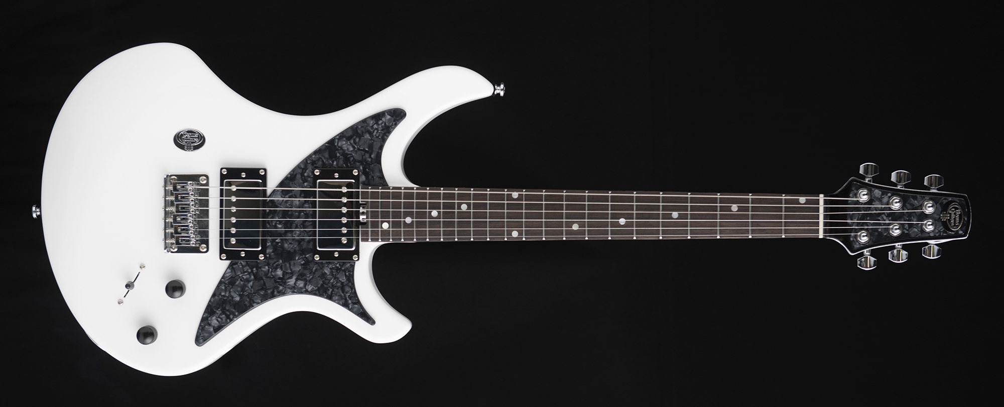 A photo of a white Venus Revolution electric guitar
