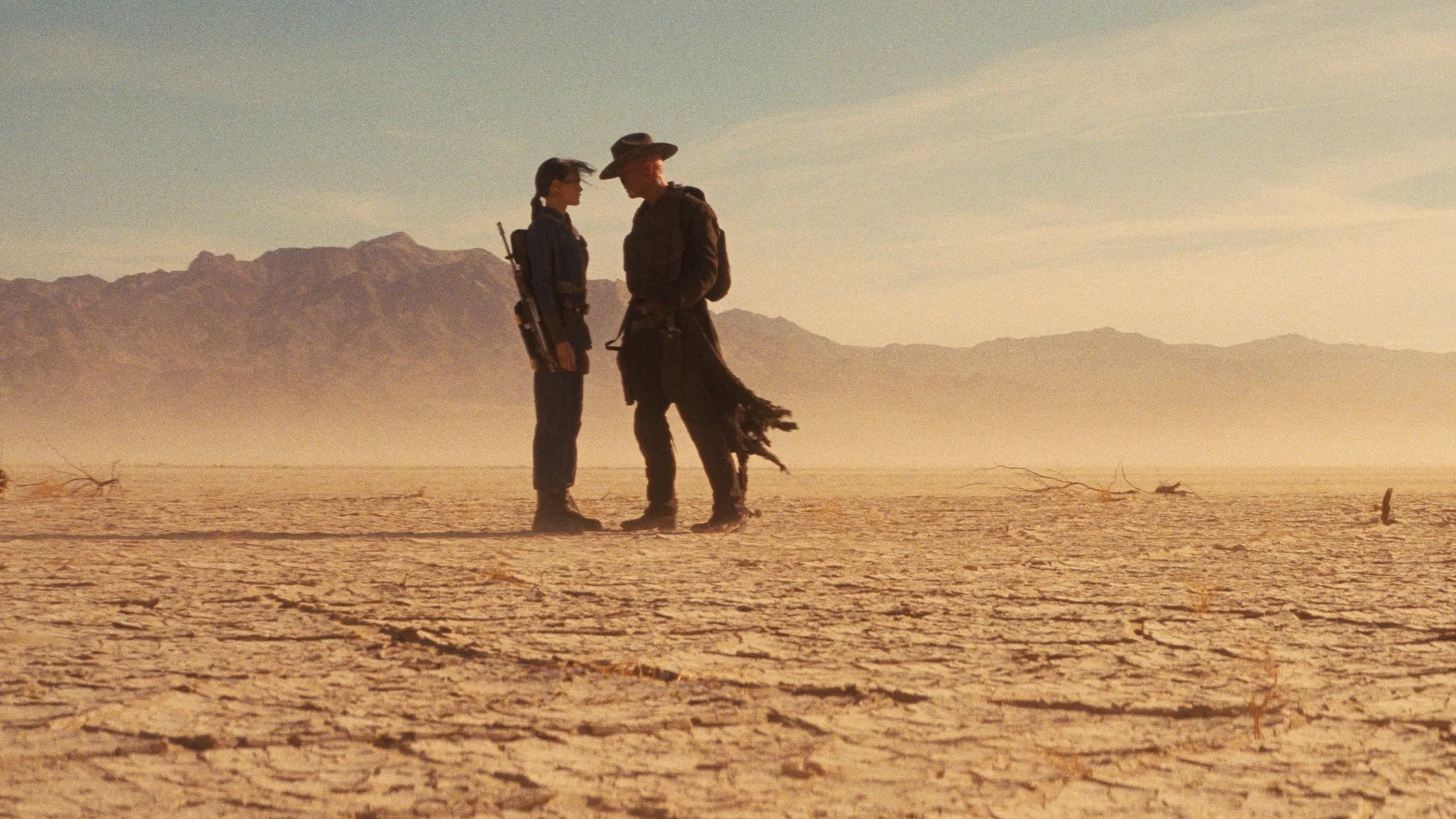 The Ghoul and Lucy standing in the dessert in Fallout season 2 