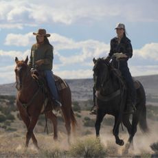 Two women on horseback (Minka Kelly as Quinn and Lauren Glazier as Angie O’Grady) in Episode 103 of Ransom Canyon.