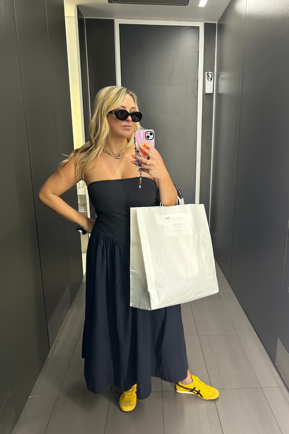 Marie Claire fashion editor Clementina Jackson wears black maxi dress yellow Onitsuka Tiger trainers