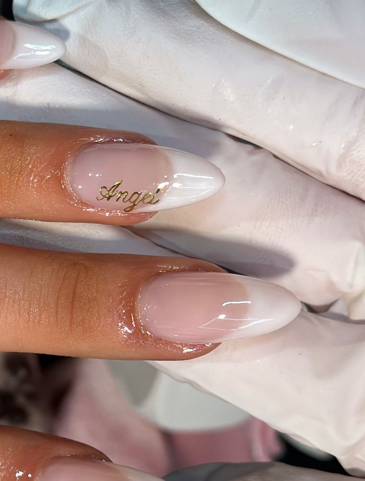 Tate McRae's calligraphy nails.