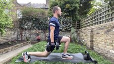 Man performing dumbbell lunges