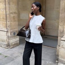 An image of @sylviemus_ wearing a pintuck top from Khaite while in Paris.