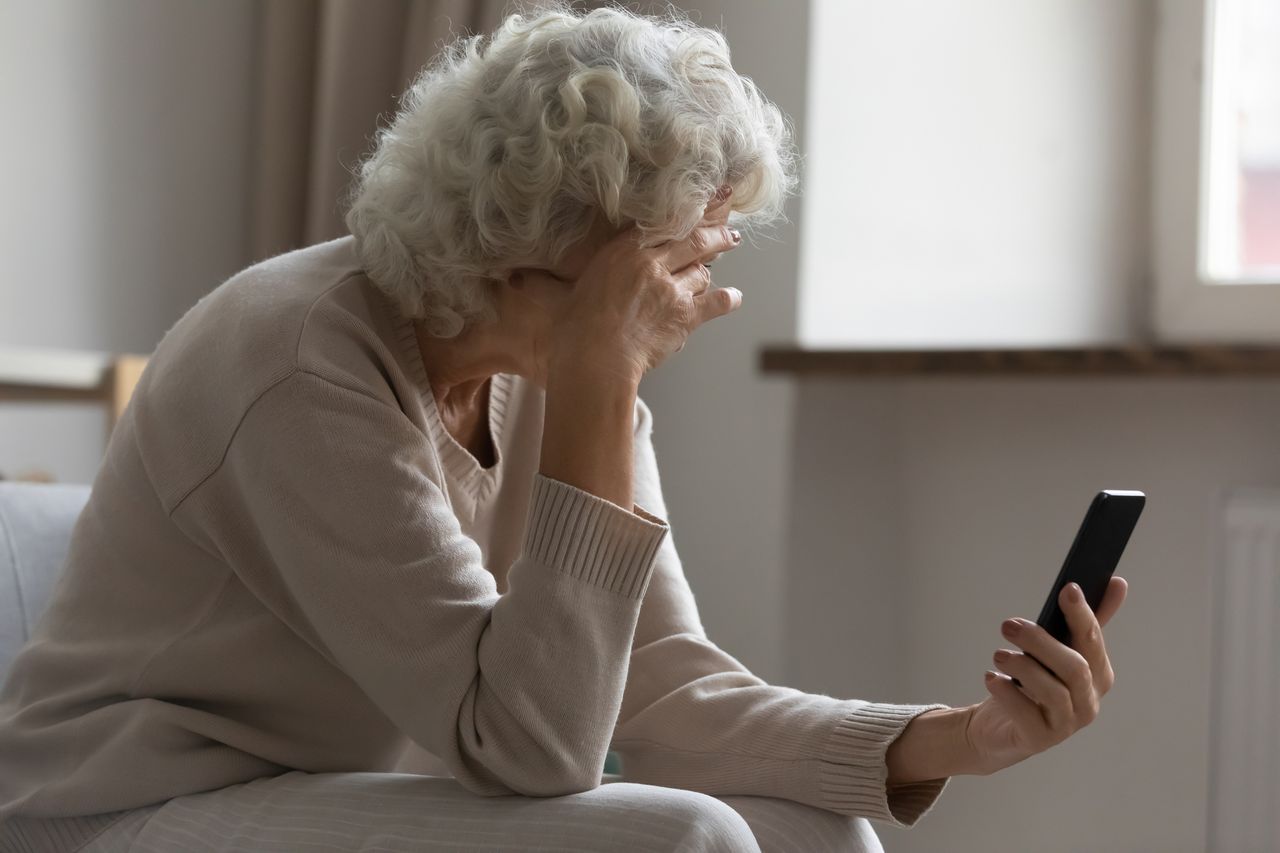 A woman holding a phone.