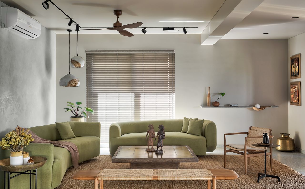 A living room with two perpendicular sofas