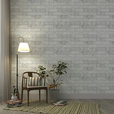 grey marble tile wall standing lamp and chair with cushion