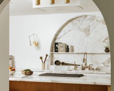 kitchen seen through an arched door
