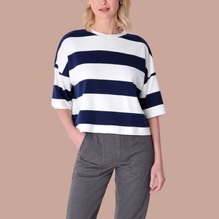 Flat lay image of woman wearing striped t-shirt