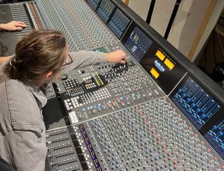 Students learn how to use a mixer at Sheffield studios with the help of Solid State Logic.