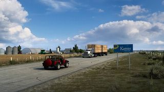 A car and a truck cross the Kansas border in American Truck Sim.