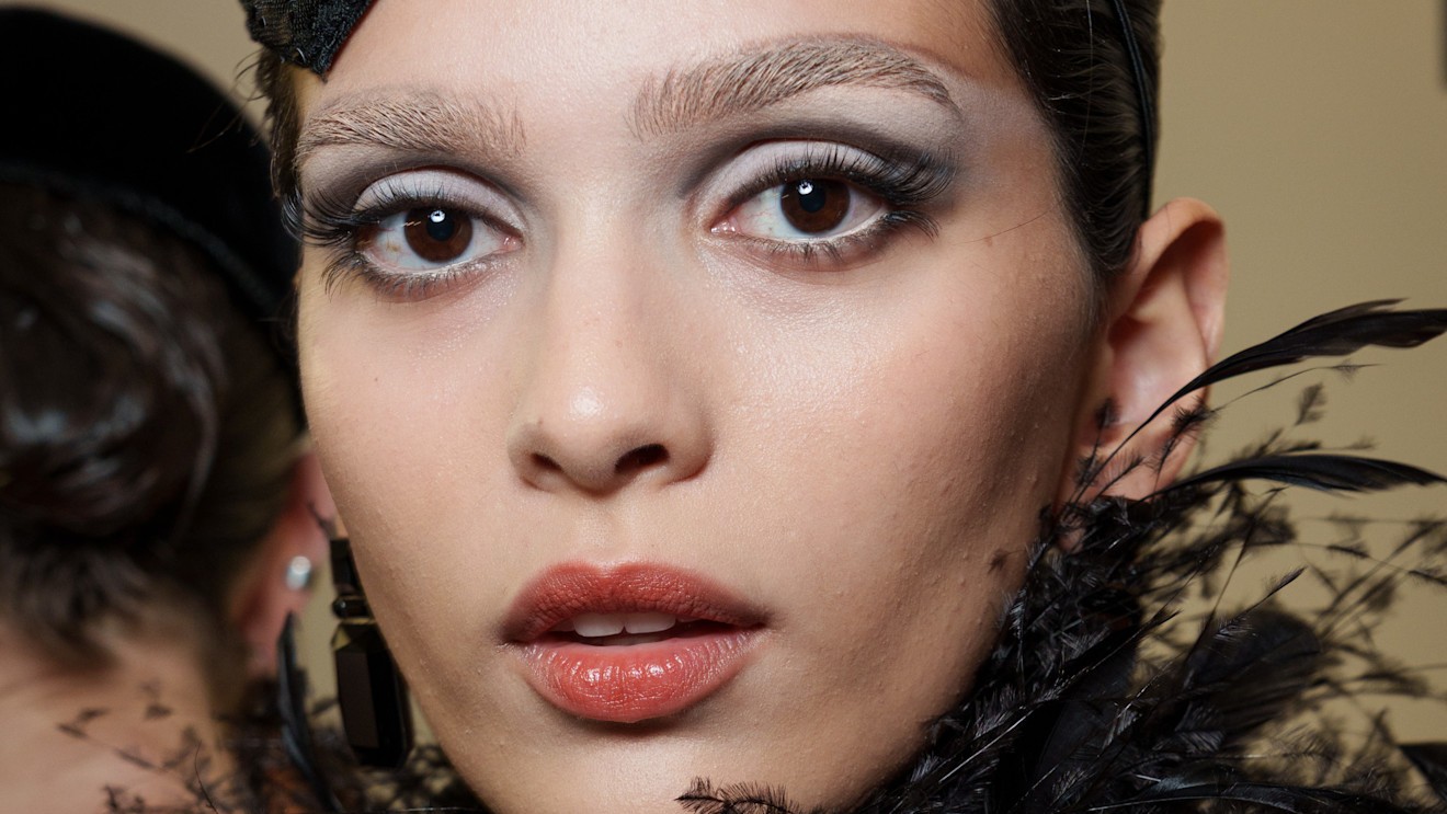 A model wearing volumizing mascara on her long lashes.