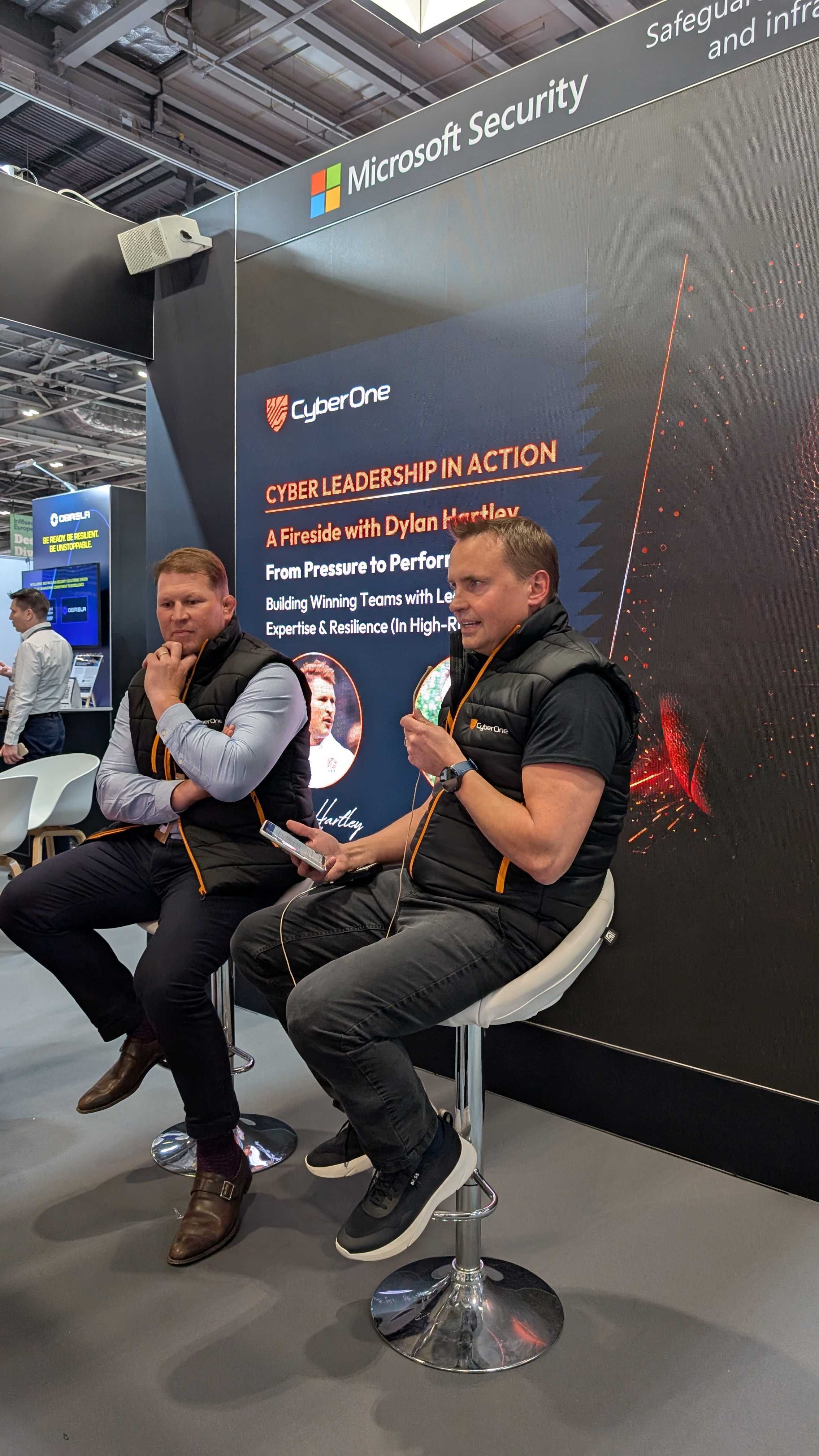 CyberOne CEO Dominic List and England rugby legend Dylan Hartley at Infosec 2025