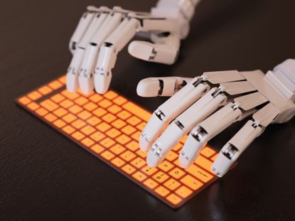 Robot hands typing on a keyboard.