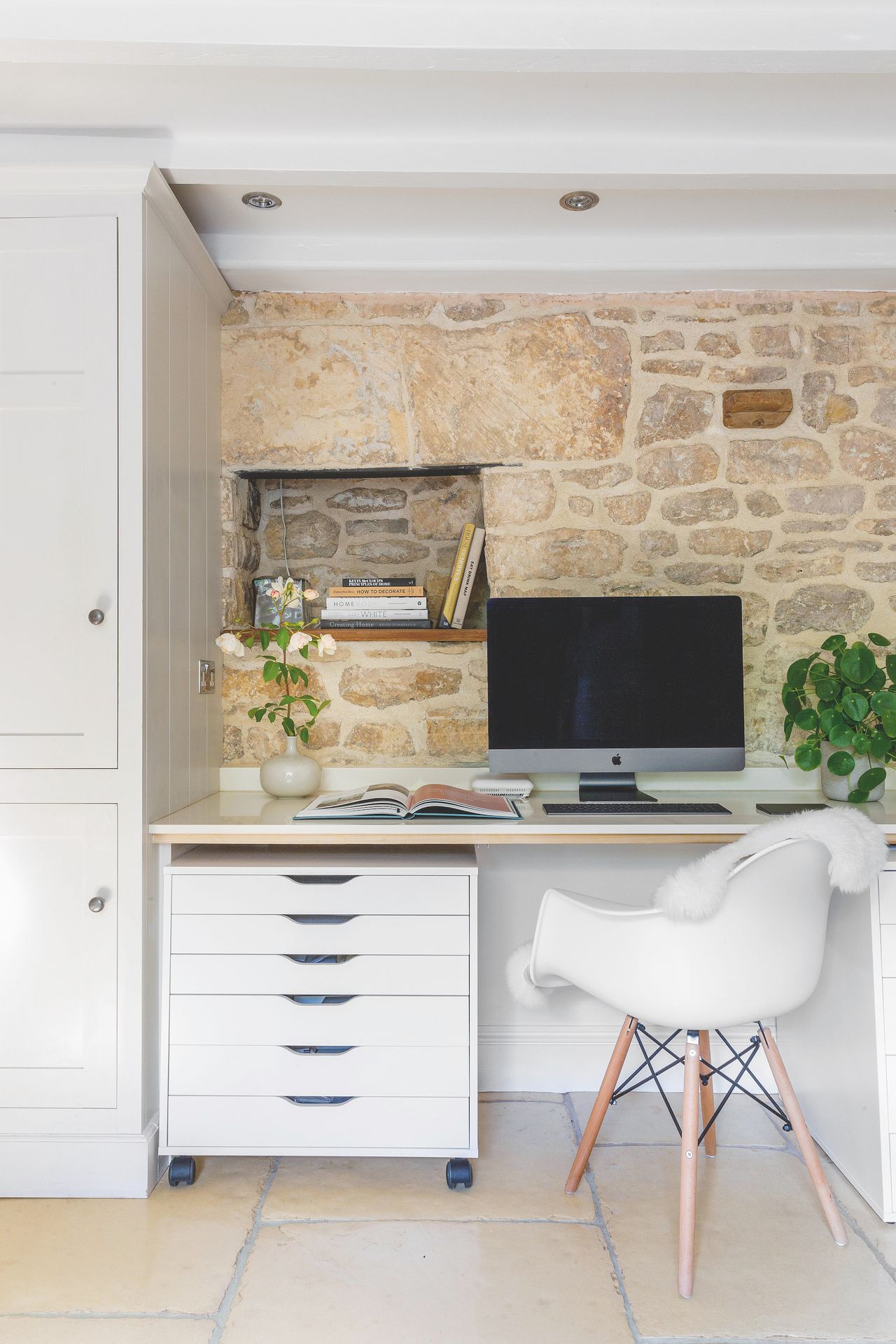 stone wall in home office with desk