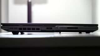 Asus Vivobook Pro 15 (N6506, 2025) closed on a white table, highlighting the tall rubber feet.