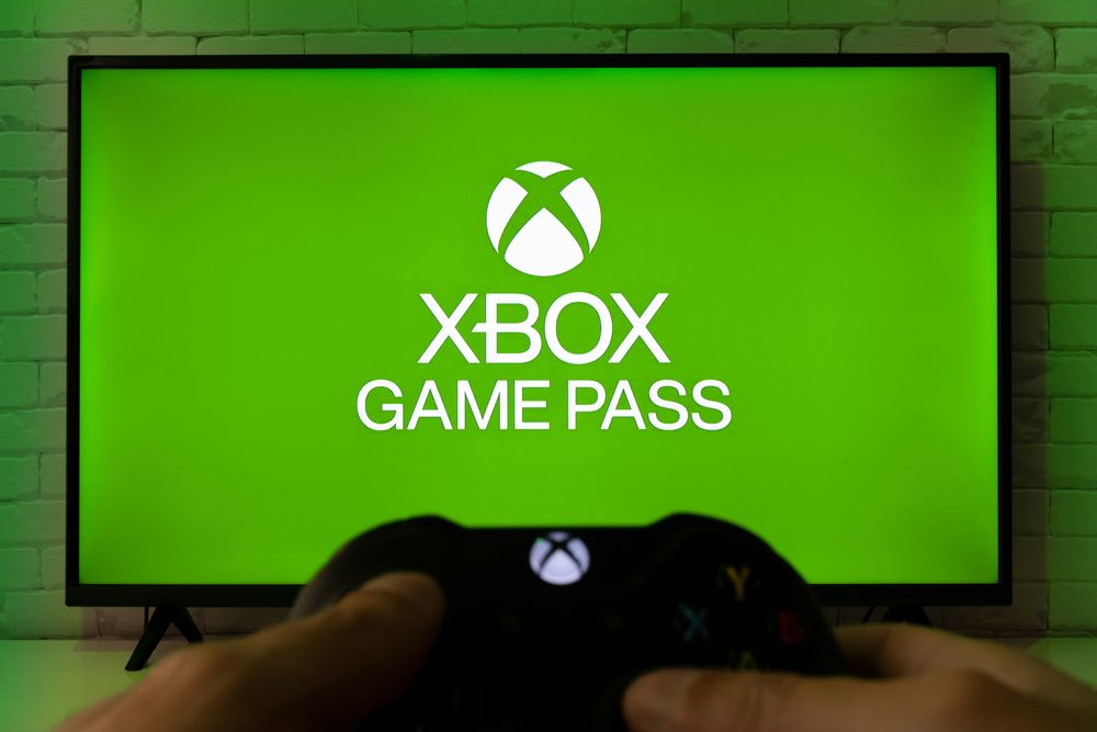 Image of a gaming controller in front of a TV with XBox Game Pass written on it