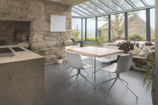 glass extension to stone cottage kitchen