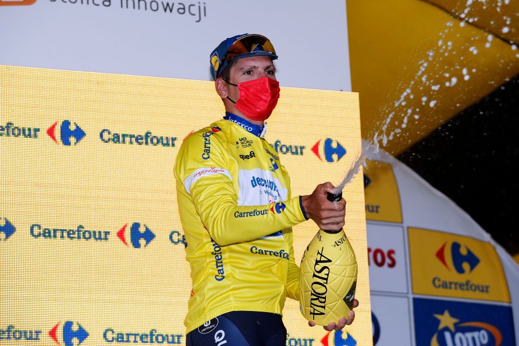 RZESZOW POLAND AUGUST 11 Joo Pedro Gonalves Almeida of Portugal and Team Deceuninck QuickStep Yellow Leader Jersey celebrates at Podium during the 78th Tour de Pologne 2021 Stage 3 a 226km stage from Sanok to Rzeszw TourdePologne TDP2021 UCIWT on August 11 2021 in Rzeszow Poland Photo by Bas CzerwinskiGetty Images