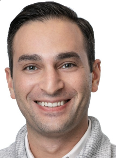 Headshot of Rafi Friedman with beige cardigan top