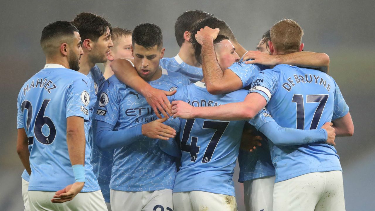 Manchester City players celebrate their goal in the 1-0 win over Brighton on 13 January 