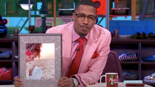 nick cannon with photo of alyssa scott and zen scott cannon