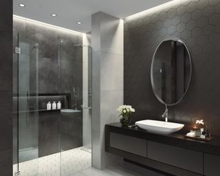 Black bathroom with vanity and mirror