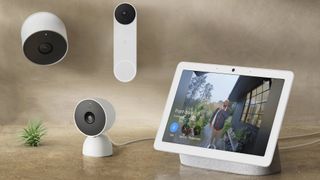 Several Google Nest security cameras next to a Pixel Tablet on a table 