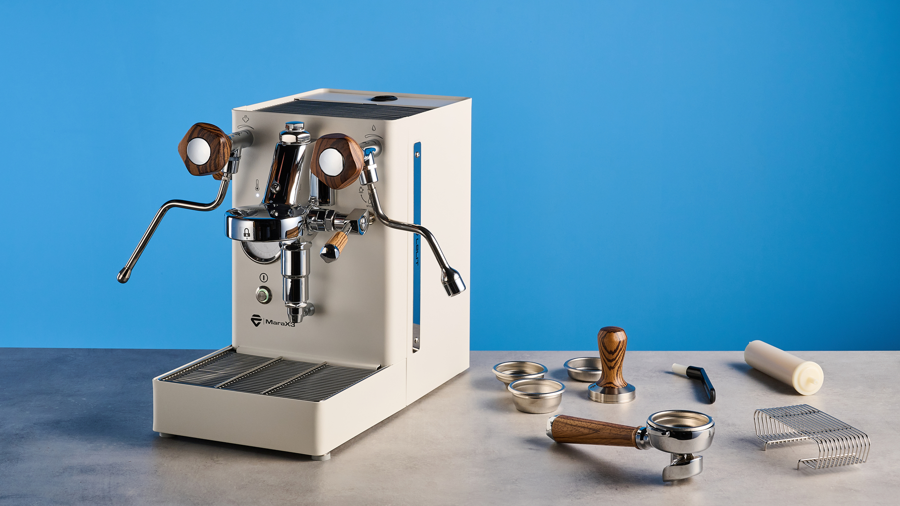 the lelit mara x3 in white and walnut photographed against a blue tom's guide background