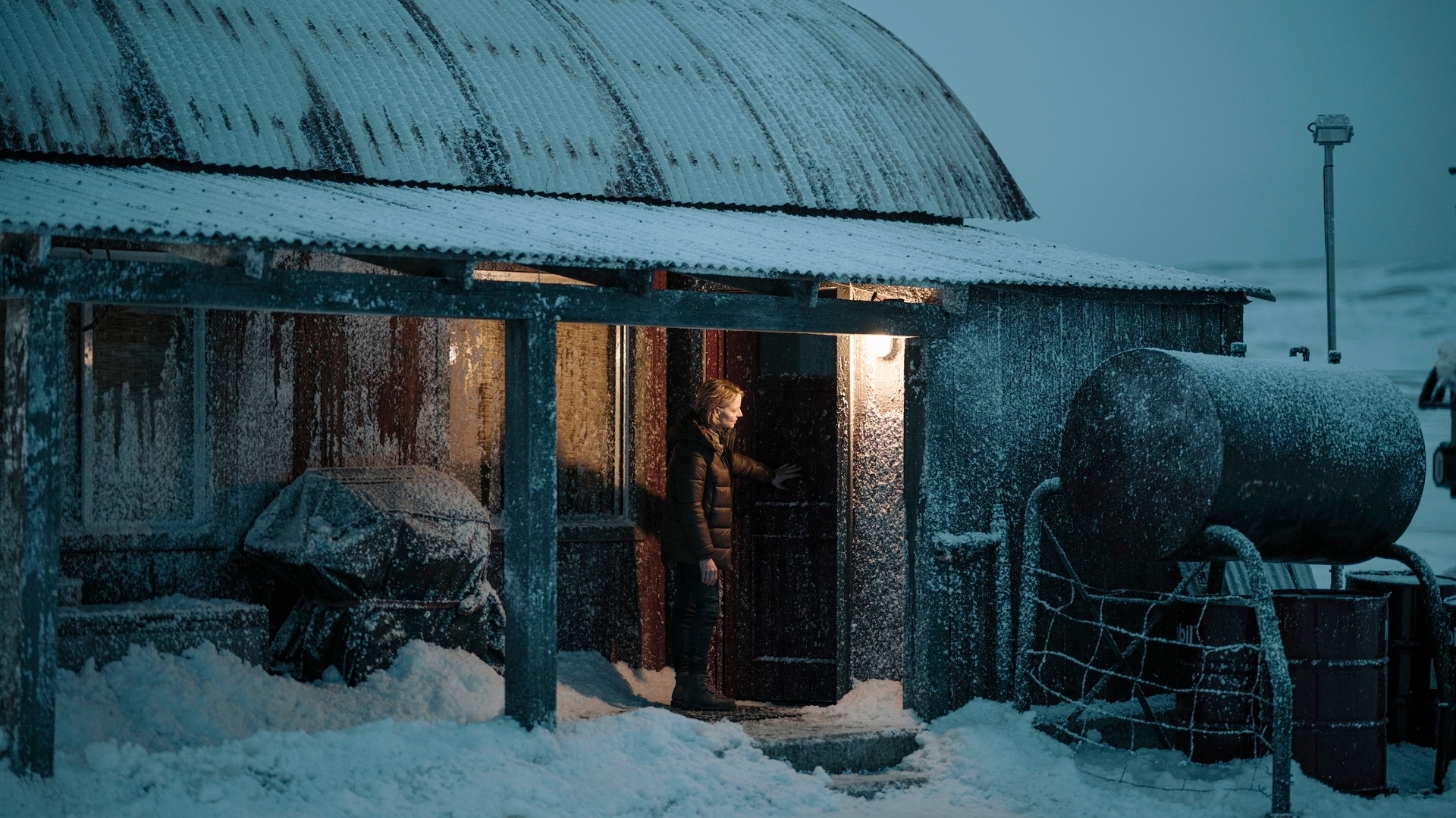 Chief Danvers stands outside a door in True Detective: Night Country