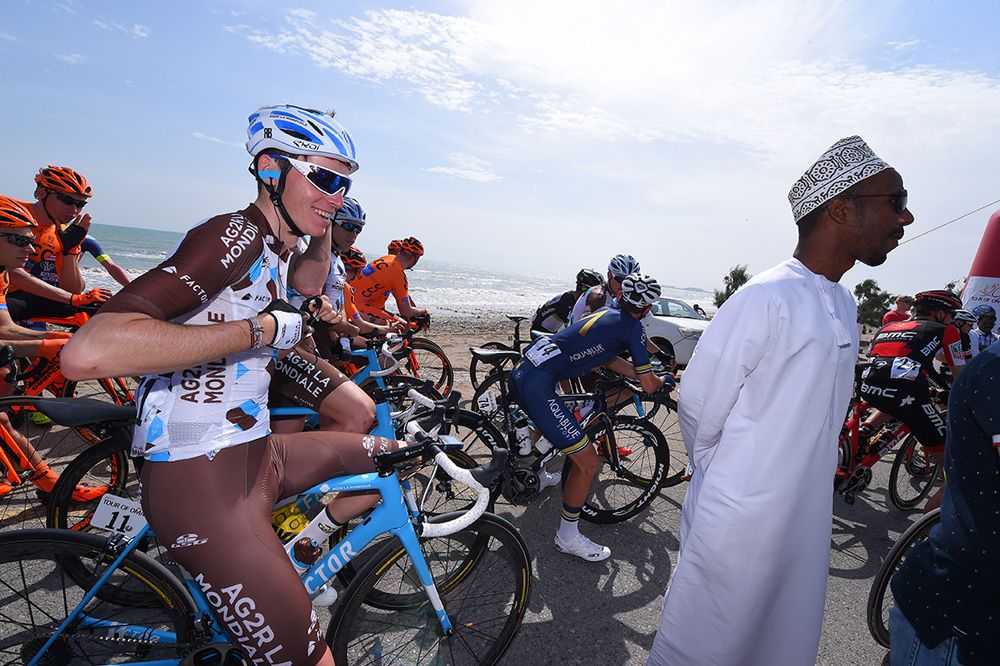 A local spectator makes Romain Bardet smile