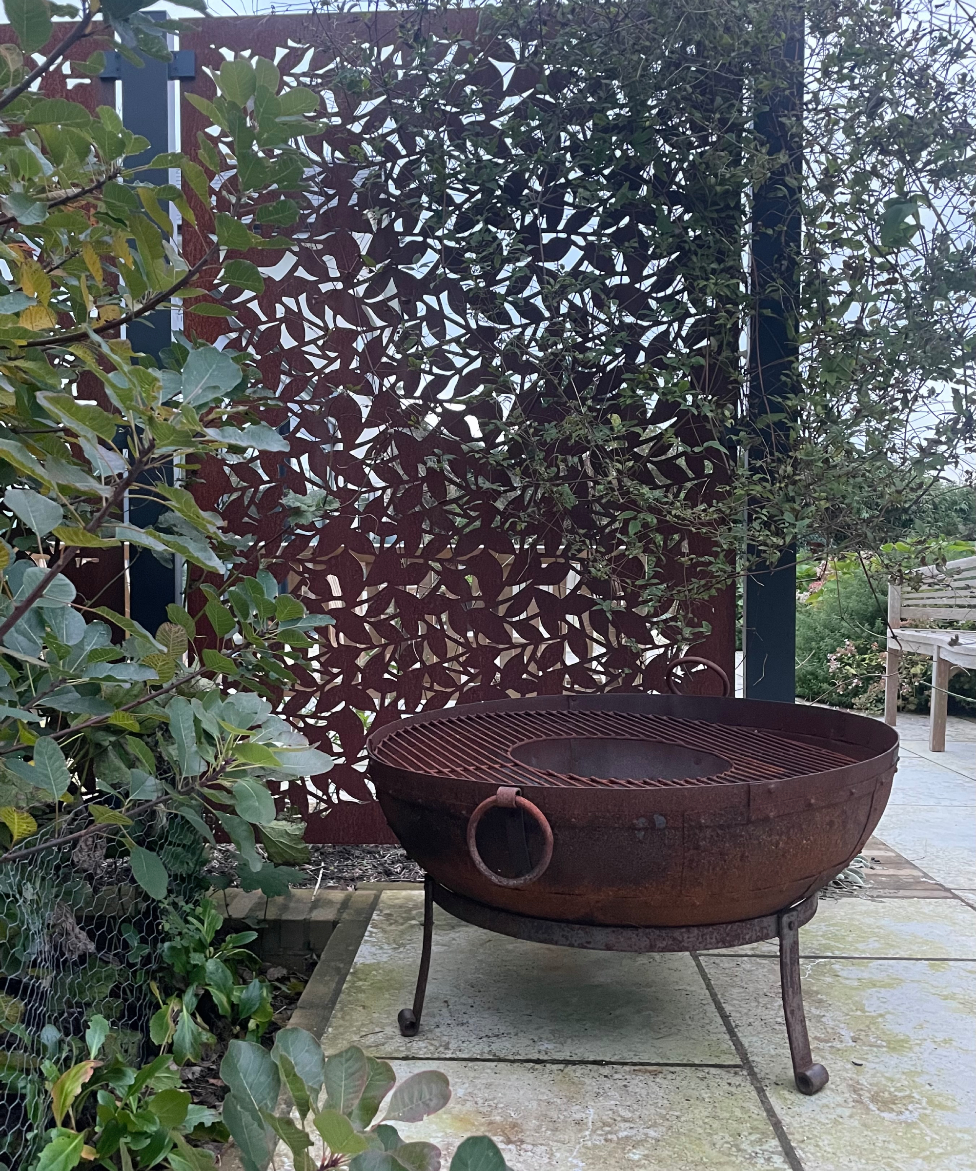 corten steel patterned screen dividing patio