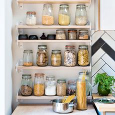 Wooden shelves with kilner jars filled with dried food