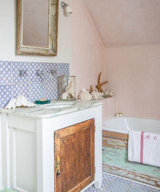 bathroom made from upcycled vintage finds with chipped paint