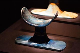 This headrest, made of blue faience (glazed ceramic), was found in the tomb of Tutankhamun. It could be used a bit like a pillow.
