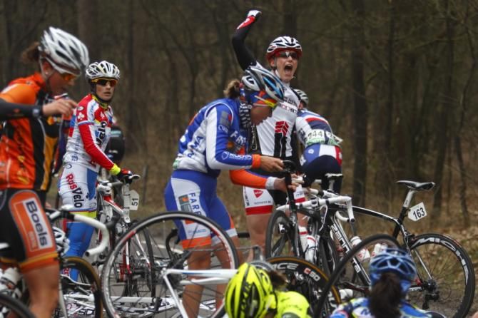 Monique Van De Ree (Cyclelive Plus - Zannata) calls for medical attention for the riders on the ground after the large crash