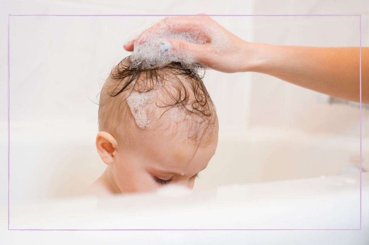 Parent washing their toddler&#039;s hair