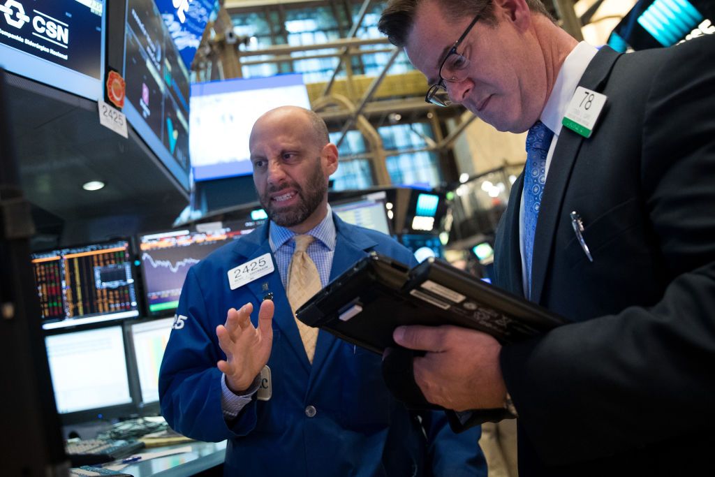 Traders work on the floor of the New York Stock Exchange.