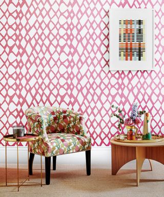 Pink room with pink and white pattern wallpaper, woven table and chair