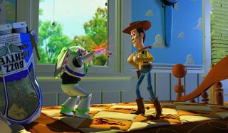 Toy Story Buzz aims his laser at Woody