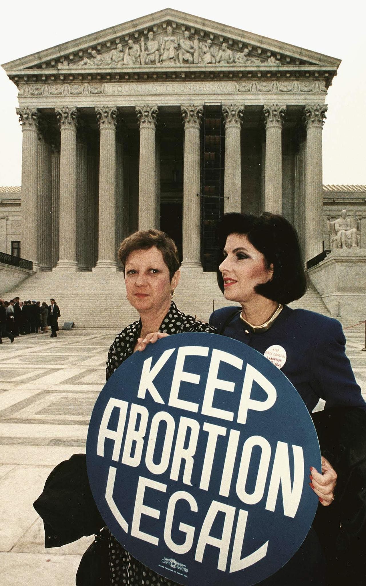 Norma McCorvey and Gloria Allred.