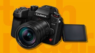 The Panasonic Lumix GH6, one of the world's best video cameras, on an orange background