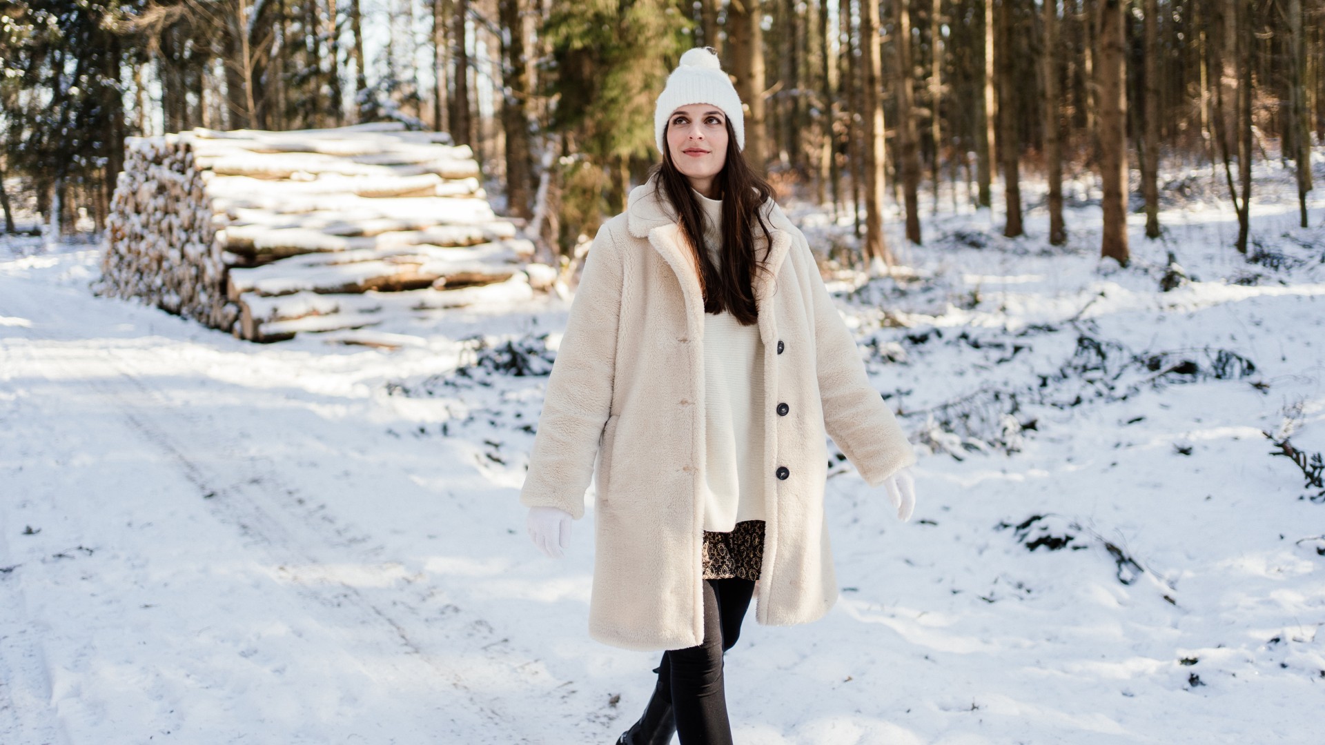 Woman walking outdoors in the snow