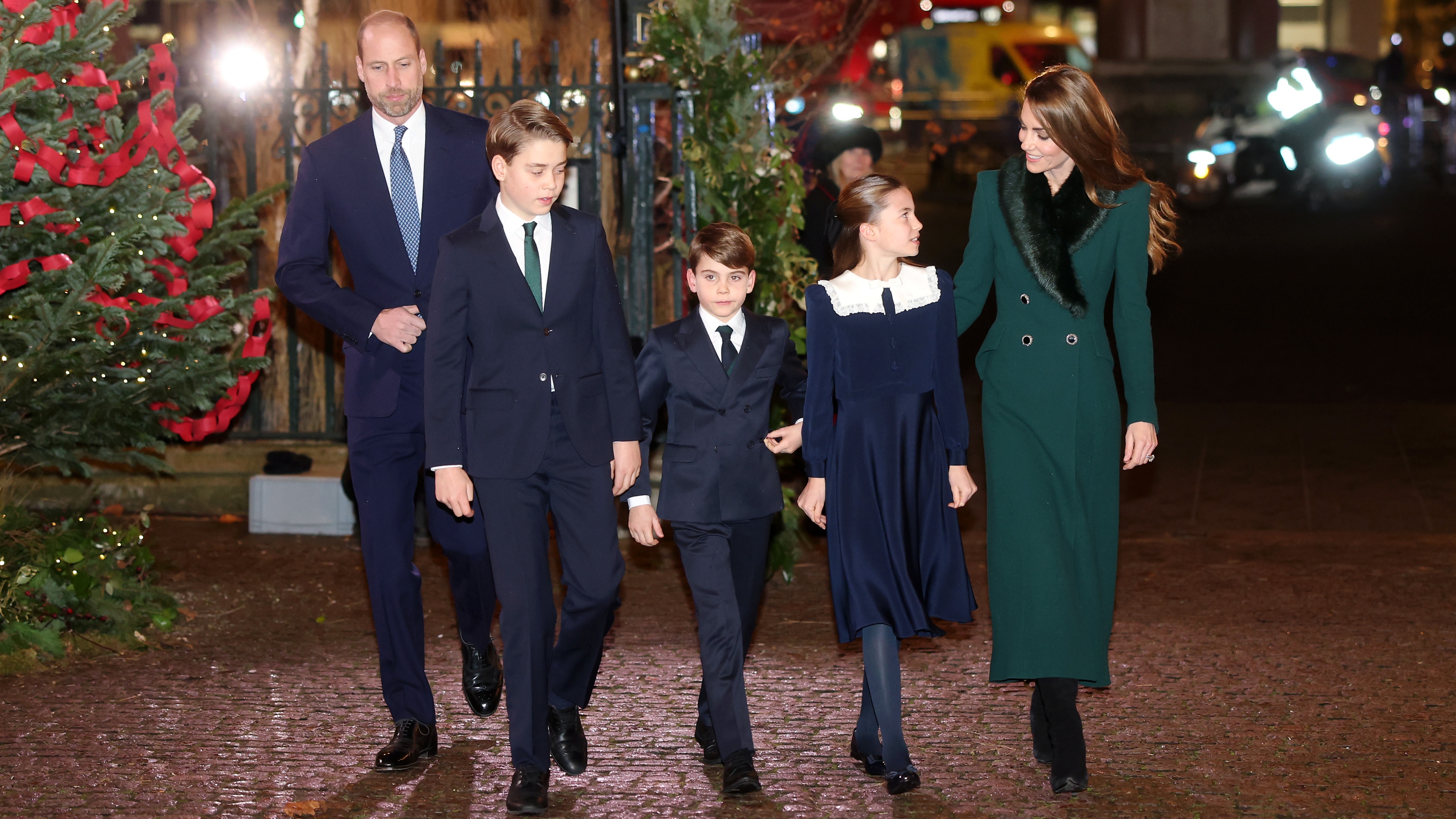Prince William, Prince George of Wales, Prince Louis of Wales, Princess Charlotte of Wales and Catherine, Princess of Wales attend the 'Together At Christmas' Carol Service