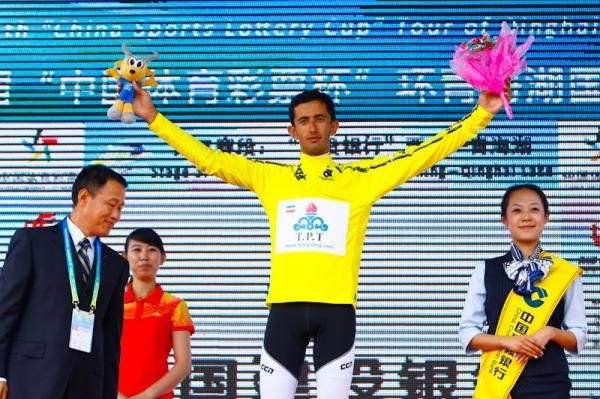 Hossein Alizadeh with yellow jersey at podium