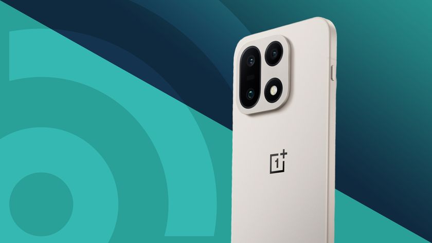 The OnePlus 15 on a teal TechRadar background